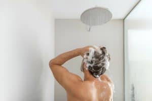 Man on stand-up shower stall