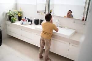 Young man looking in the mirror